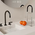Black Faucets With Running Water Over White Sink And Oranges On Light Countertop