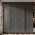 Elegant Dark Wooden Wardrobe With Multiple Doors Open Shelves And Decorative Items