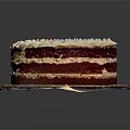 Layered Red Velvet Cake With White Frosting And Red Sprinkles On Plate