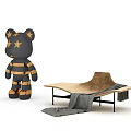 Brown Lounge Chair With Black Metal Frame And Gray Blanket Next To Stuffed Bear