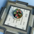 Round Fish Tank Featuring Pink Lotus Flowers Lily Pads And Colorful Fish On Tiled Floor