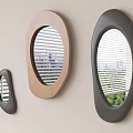 Three Oval Mirrors with Black and Wooden Frames on Light Wall Showing City View
