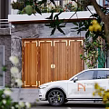 Detached Villa Exterior With Large Windows Greenery And Wooden Gate