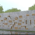 Wooden Shelves And Hooks For Daily Essentials On Gray Stone Wall With Trees And Pond Reflection