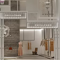 Elegant Clothing Store Window Display With Stylish Mannequin Hanging Lights And Decorative Plants