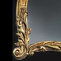 Elegant Mirror With Ornate Gold Frame And Intricate Carving Details