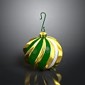 Shiny Green And Gold Striped Christmas Ornament With Hanger On Black Surface