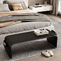 Stylish Black Leather Bed Bench at Foot of Bed with Magazines and Slippers on Bedroom Rug