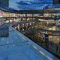 Vibrant Commercial Street Night View With Multi Level Glass Facade Shops Bright Lighting And Pedestrians