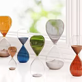 Colorful Hourglass Decorative Ornament Set On Window Sill With Green Plants Background