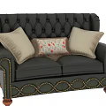 Vintage Green Leather Tufted Sofa With Rolled Arms Wooden Legs And Patterned Cushions