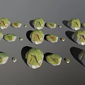 Green And White Decorative Stone Pieces With Colorful Lines And Small Ornaments