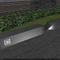 Modern Black Landscape Bench With Sleek Design Green Shrubs Stone Wall And Paved Ground