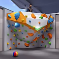 Indoor Rock Climbing Wall For Fitness Training With Colorful Holds And Indoor Setting