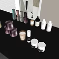 Perfume and Cosmetic Products Various Colored Bottles and Jars on Black Table