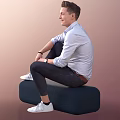 Smiling Man Sitting On Dark Blue Bench In Light Blue Shirt And White Sneakers
