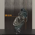 Sleek Metallic Abstract Sculpture With Curved Design And Dark Wooden Backdrop