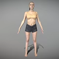 Woman In Light Yellow Top And Dark Shorts Standing Barefoot On Gray Background