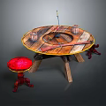 Rustic Round Wooden Table With Red Stool Cups Knife And Fishing Rod