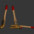 Wooden Paintbrushes With Red Handles And Yellow Bristles On Dark Surface