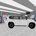 SunRise 4S Showroom Featuring White SUV On Display With Bright Lights And Surrounding Posters