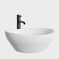 Modern White Above Counter Washbasin With Sleek Black Faucet Design