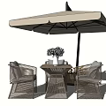 Outdoor Table and Chair Set with Umbrella and Flowers in Green Grass Garden