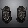Two Horned Leather Masks With Intricate Metal Carvings And Hooded Design