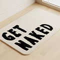 Square Cream Colored Rug With GET NAKED Text On Wooden Floor