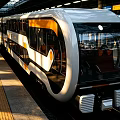Modern Electric Train With White Yellow Body And Large Windows At Subway Station Platform