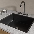 Modern Black Kitchen Sink On Speckled Countertop With Black Faucet And Silver Candles