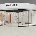 White Curved Clothing Store With Glass Display Windows And Interior Clothing Racks
