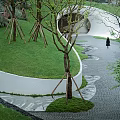 Garden Landscape With Brick Path Green Yellow Trees And White Golf Cart