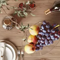 Elegant Ceramic Ware Display on Wooden Table with Fresh Fruits Wine Glasses and Olive Branch