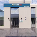 Modern Entrance Facade With White Carport Two Black Vehicles Green Structure And Metal Gate
