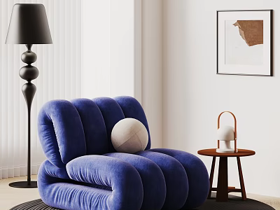 Blue Plush Single Sofa With Curved Design Black Floor Lamp Side Table And Wall Art 3d model