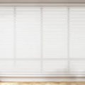 White Venetian Blinds Covering Whole Window In Home Interior With Wooden Floor