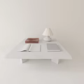 Minimalist White Coffee Table With Open Book Notebook White Table Lamp And Red Box 3d model