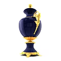 Blue And Gold Decorative Vase With Floral Patterns And Ornate Handles