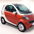 Red and White Compact Car With Black Roof And Round Headlights