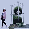Multi Tiered White Metal Frame Garden Decor with Black Planters Green Plants and Decorative Stones