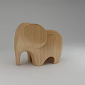 Wooden Elephant Figurine With Smooth Surface And Carved Details On Gray Background