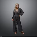 Blonde Woman in Gray Blazer and Wide Leg Pants with Brown Shoes Against Gray Background