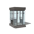 Modern Glass Security Booth With Transparent Walls In Outdoor Plaza With Trees And Blue Sky