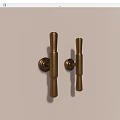 Two Sleek Modern Brass Cylindrical Handles Mounted on White Background