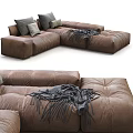 Brown Leather Sectional Sofa With Gray And Beige Pillows And Throw Blanket 3d model