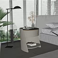 Modern White Bedside Table with Vase and Magazine in Bedroom with Bed and Green Plants