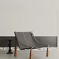 Stylish Minimalist Lounge Chair With Wooden Legs And Black Cushion Design