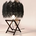 Illuminated Table Lamp With Black Feather Lampshade And Wooden Cross Base