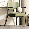 Modern Green Accent Chair With Abstract Wall Art Floor Lamp Potted Plant And Figurine
